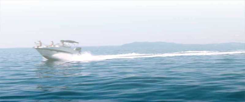 A speed boat making a path in water A speed boat making a path in water
