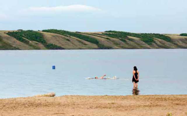 Woman standing at Manitou Beach Woman standing at Manitou Beach