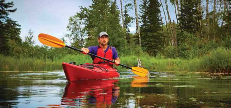 Man canoeing in a Saskatchewan lake Man canoeing in a Saskatchewan lake