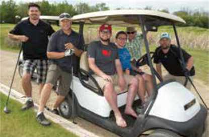 Getzlaff & Friends on golf cart Getzlaff & Friends on golf cart
